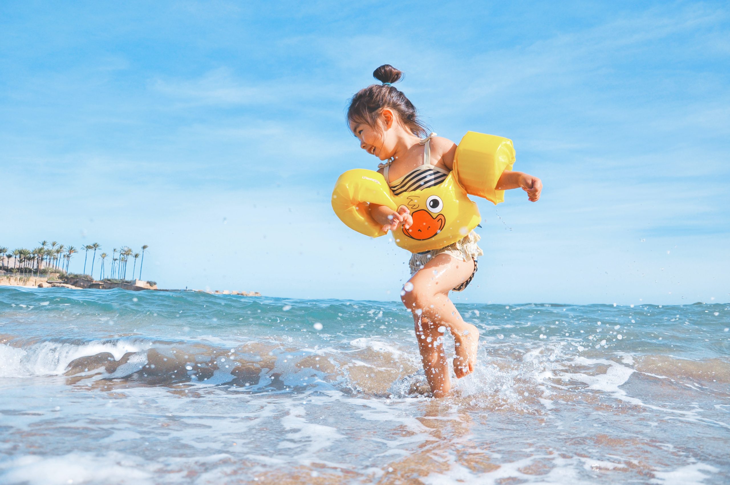 Little girl in puddle jumper